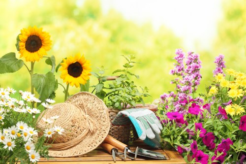 Professional gardener using protective equipment during garden work